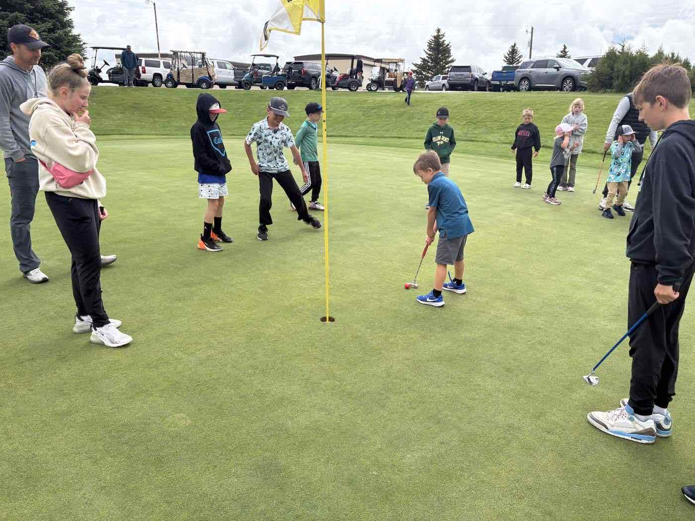 Group of junior golfers on the putting green